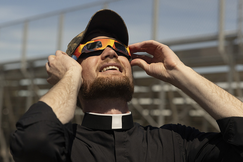 Father Jacob Wessel watched the solar eclipse April 8 on the grounds of Father John Dempsey Field in Ste. Genevieve. Several groups gathered at the field, including priests and several families, to watch the total eclipse.